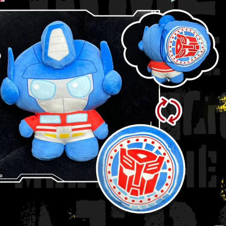 Peluche Optimus Prime bleu et rouge, logo Autobot visible au dos, style cartoon – Transformers.