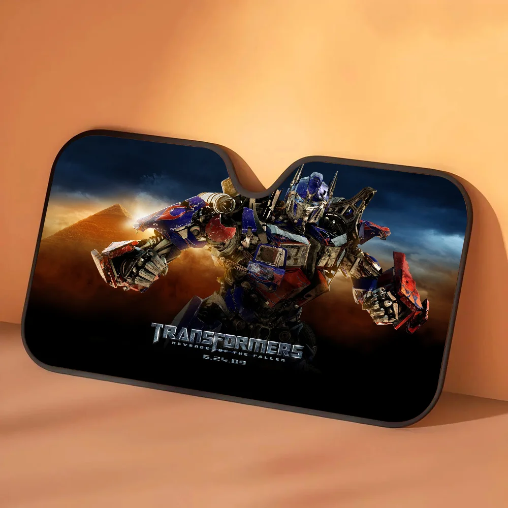 Osłona przeciwsłoneczna Transformers Optimus Prime w piaskowej burzy — Samochodowa ochrona przeciwsłoneczna w złotej pustynnej scenerii