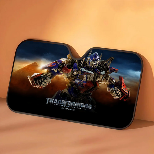 Osłona przeciwsłoneczna Transformers Optimus Prime w piaskowej burzy — Samochodowa ochrona przeciwsłoneczna w złotej pustynnej scenerii