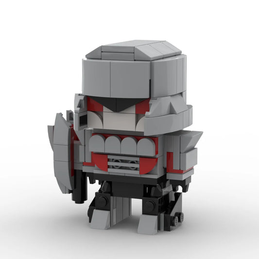 Figurka Transformers Megatron w wersji IDW Chibi — szaro-czerwony klocek, działo fuzyjne