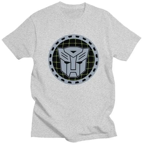 T-shirt gris avec logo Autobots stylisé en gris et noir sur fond de grille circulaire – Transformers.