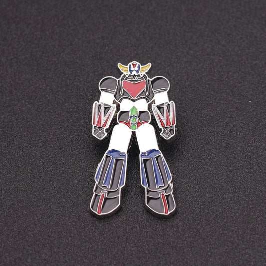 Pin émaillé robot géant coloré en métal, personnage debout sur fond noir – Transformers.